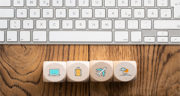 cubes with travel icons on wooden background
